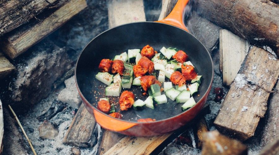 meat and vegetable on cooking pan over fire