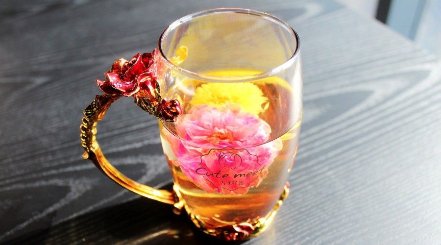 flowers floating in a tea cup
