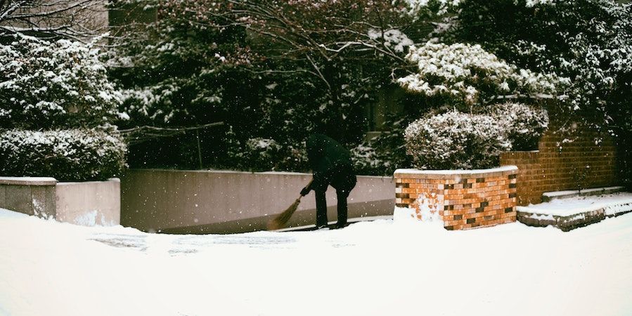 Person clearing a path in the snow 