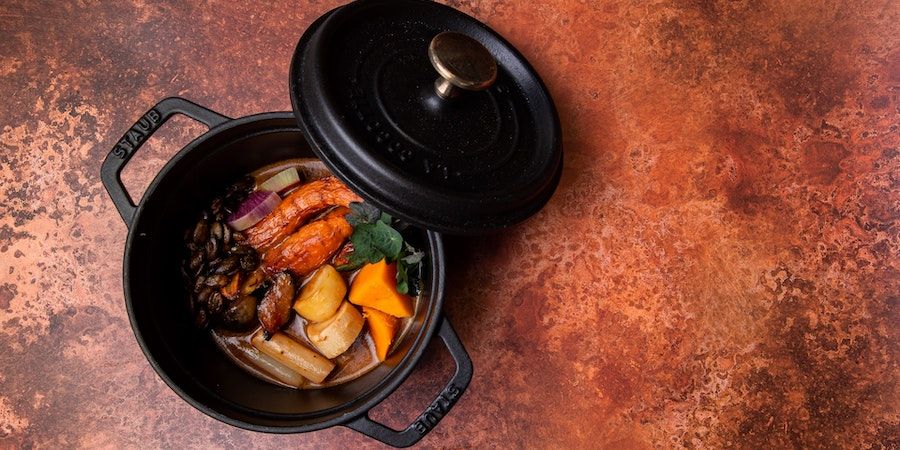 Various vegetables in a cast iron pot 