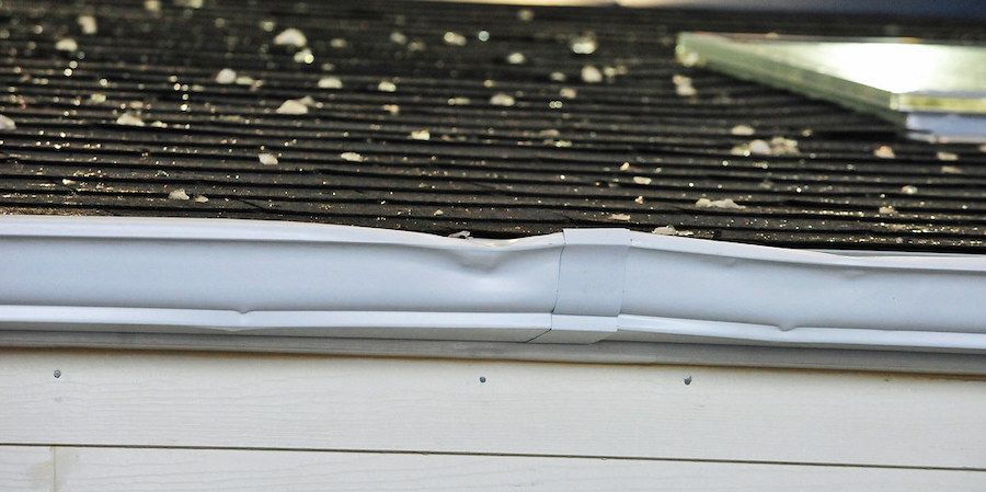 Dented roof gutter 