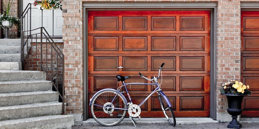 Bicycle in front of wooden garage door 