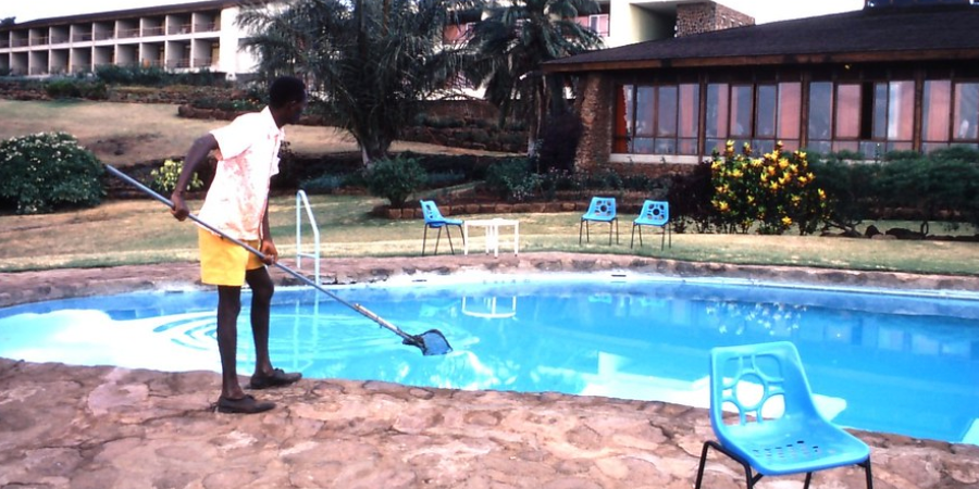 Man Cleaning Pool