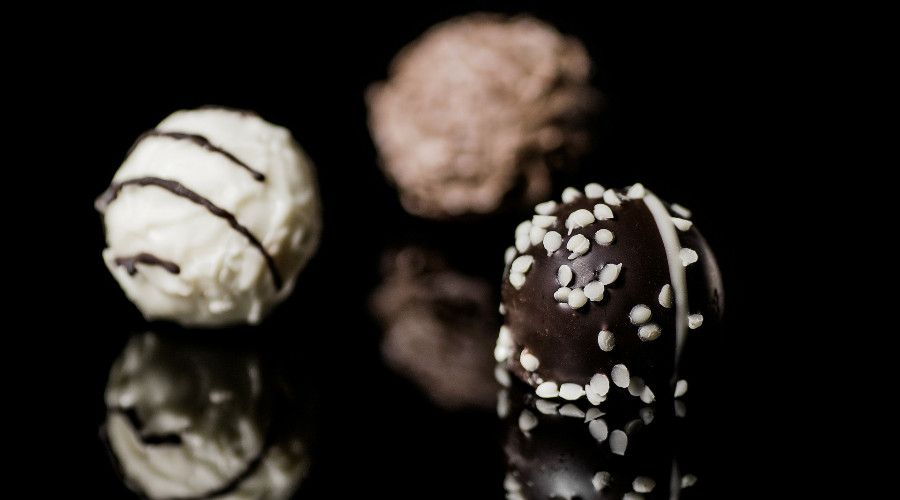 Chocolate truffles in dark, milk, and white chocolate varieties