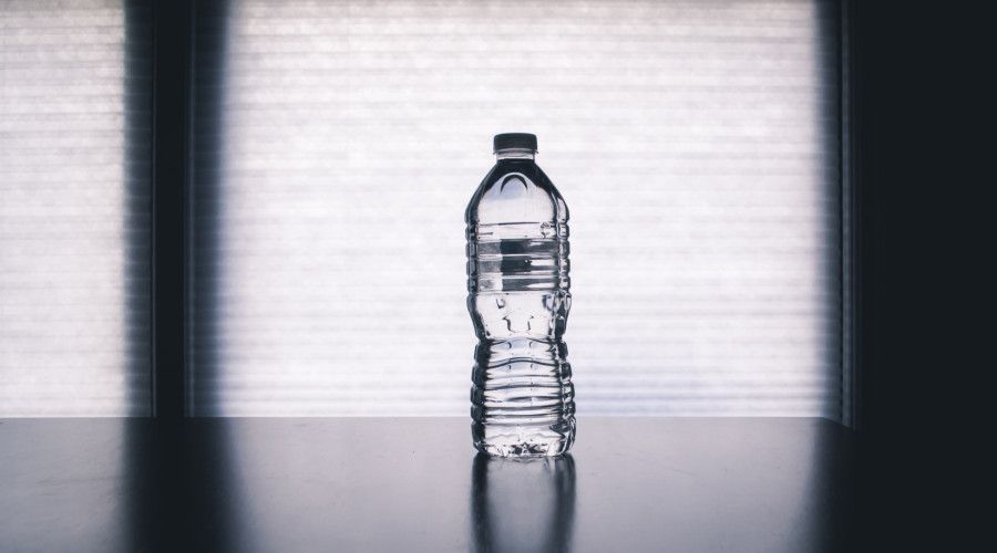 Single water bottle sitting on a table