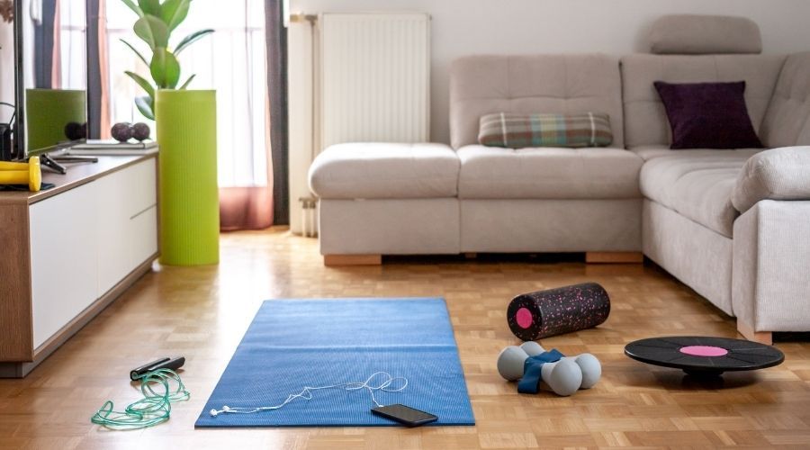 living space with couch and exercise equipment