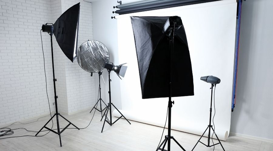 photo studio with professional lighting and backdrop