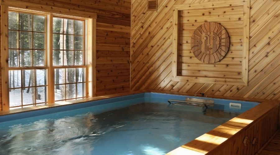 indoor pool in wooden sided room