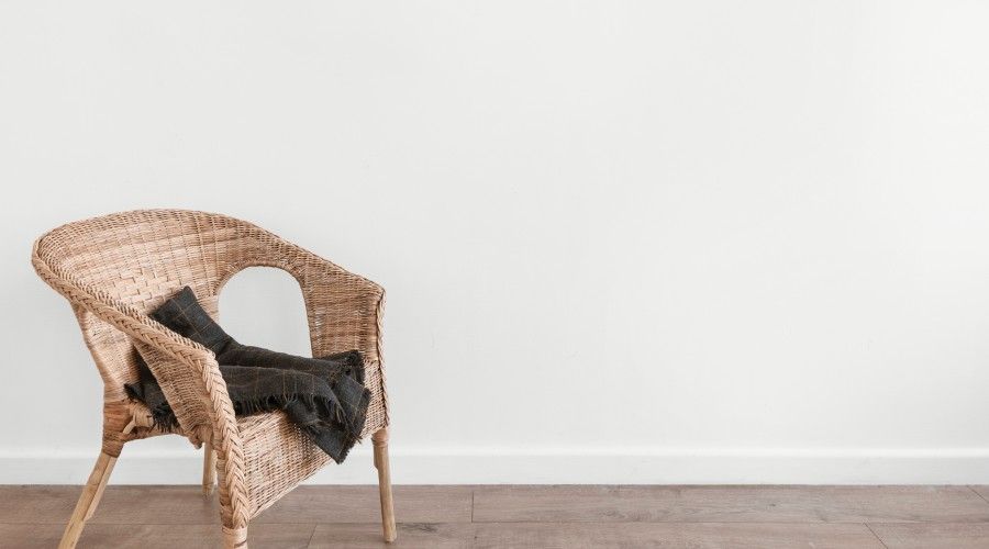 wicker chair indoors with black blanket
