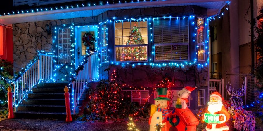 House decorated with Christmas lights at night 