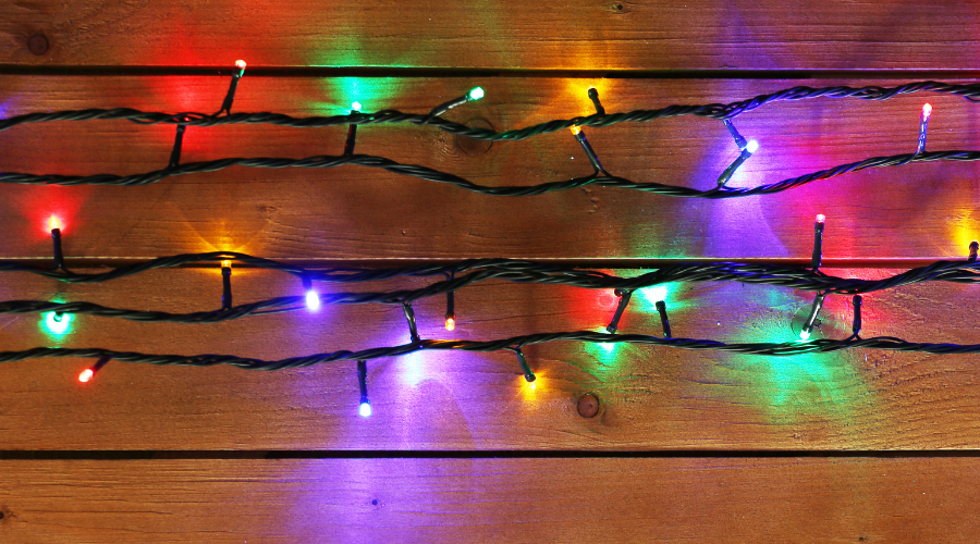 Christmas Lights Garland on Wooden Background
