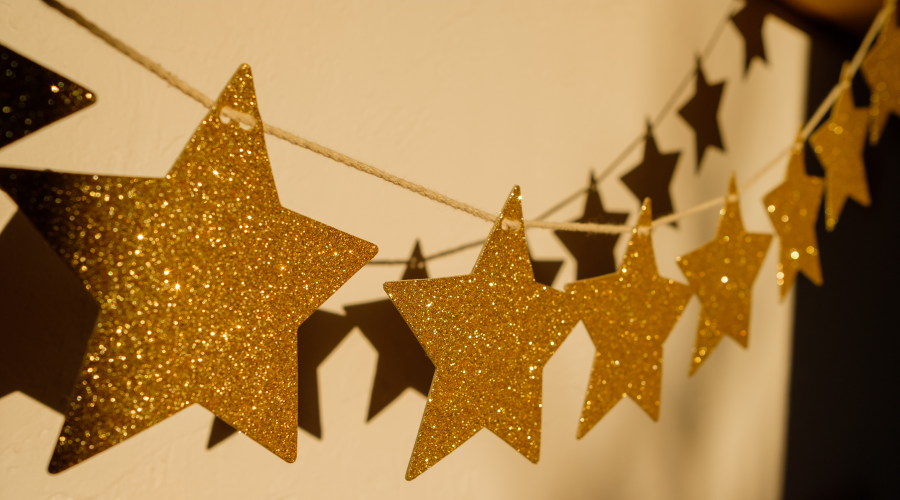 Christmas garland of golden stars on the wall