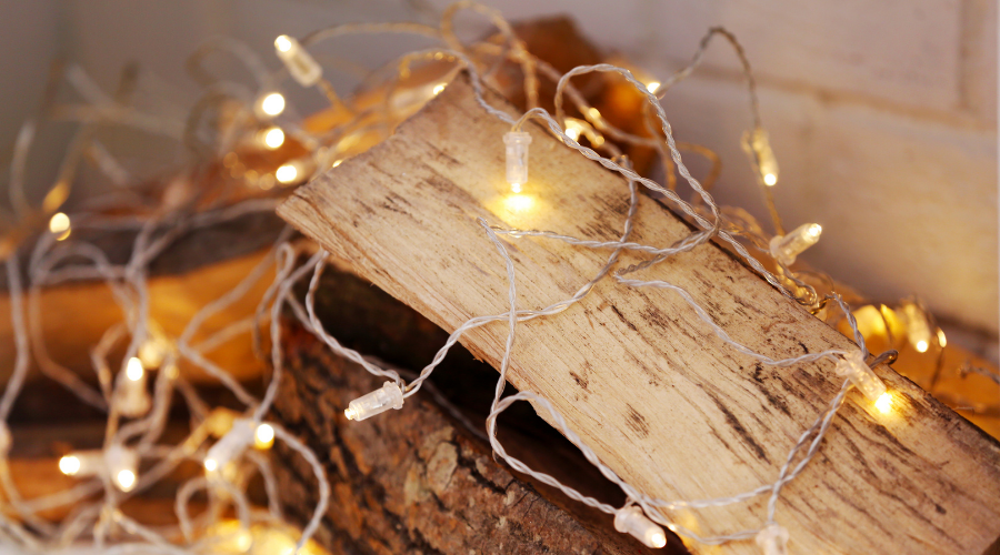 Logs and Lights in Decorative Christmas Fireplace, Closeup