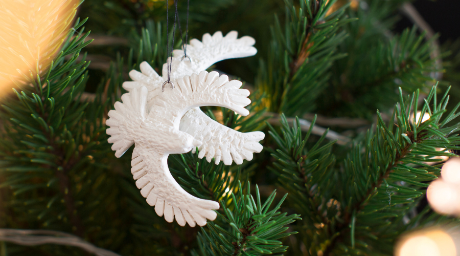 white christmas doves and garland on christmas tree