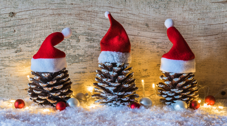 Christmas decoration with pine cones decorated with Santa hats