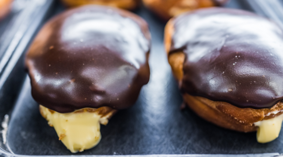 Boston cream donuts with filling oozing out