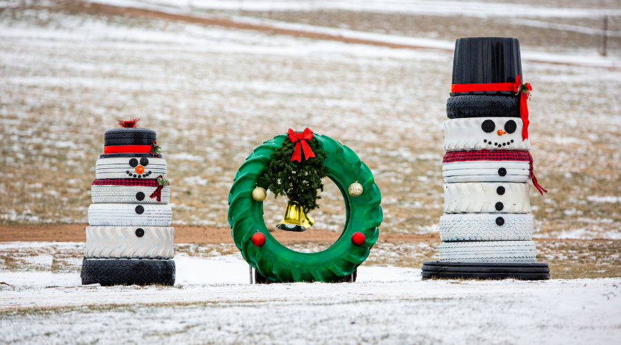 Snowmen and a wreath made out of recycled tires