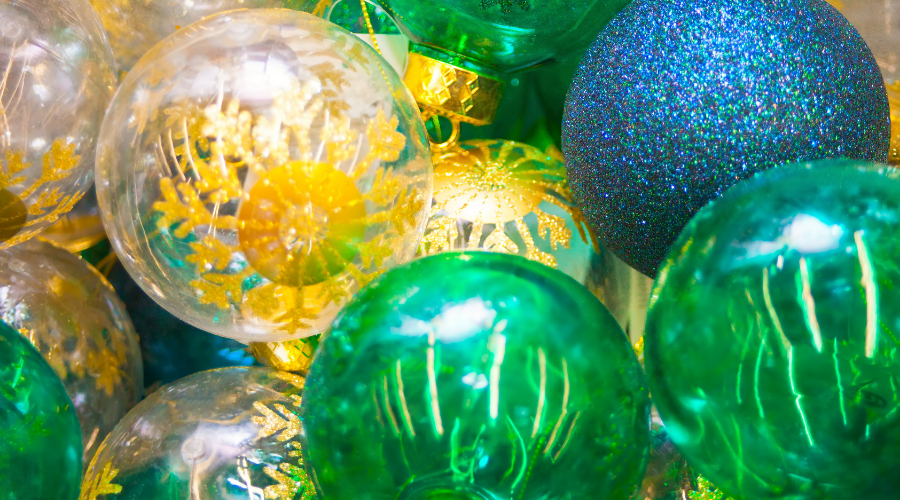 Colorful yellow, green and blue Christmas balls pattern background.