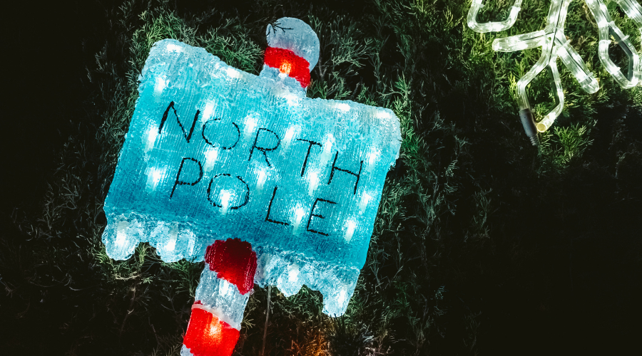 The North Pole is where Santa Claus lives, a sign indicating direction