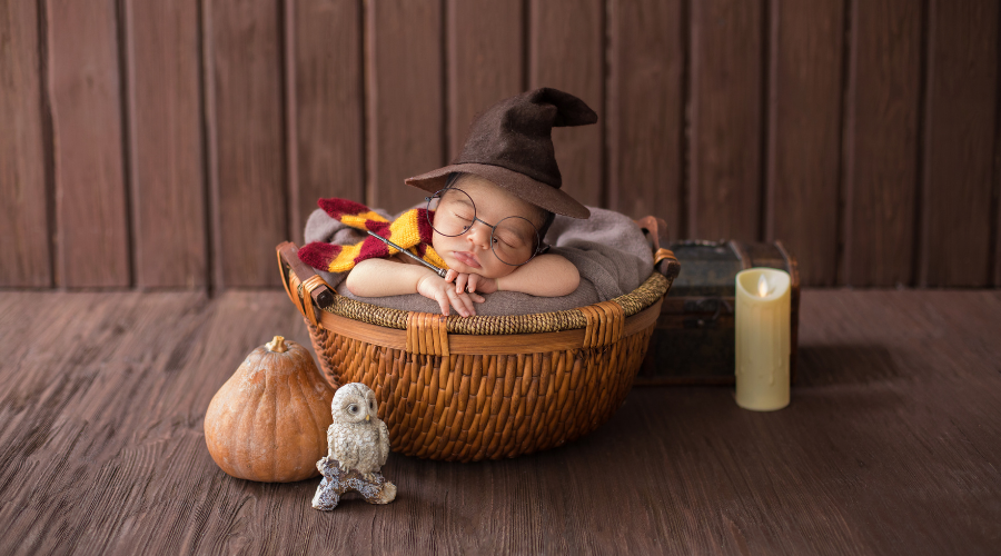 Sleeping Newborn in Harry Potter Costume Inside Wicker Basket