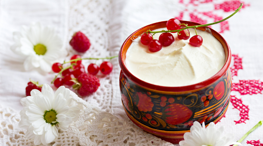 Sour Cream in a Beautiful Cup with Currant Berries.