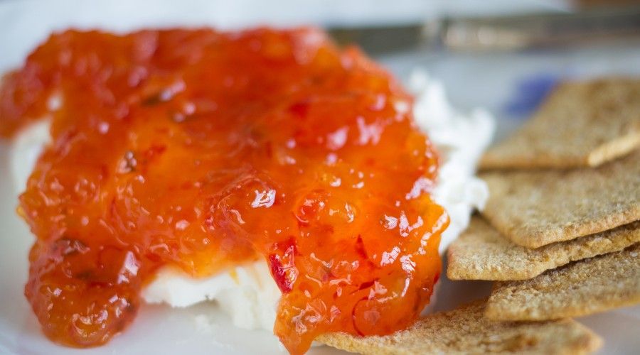 Red Apricot Pepper Jelly Served over cream cheese