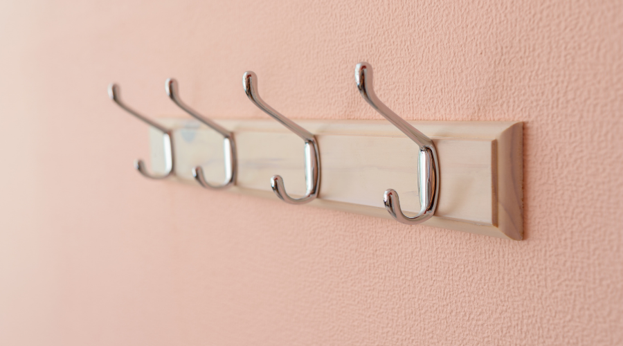 Clothes Hangers on Pink Wall