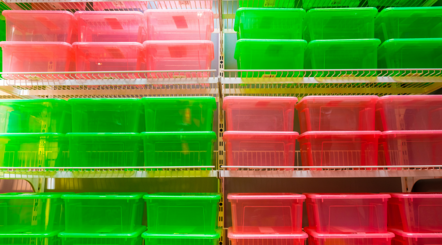 Colorful plastic containers on shelves