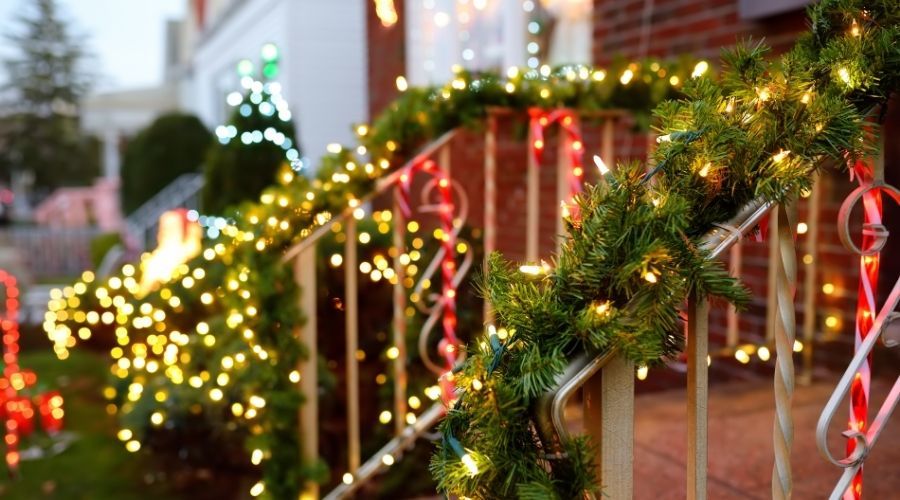 Christmas garland hanging on outdoor stair railings