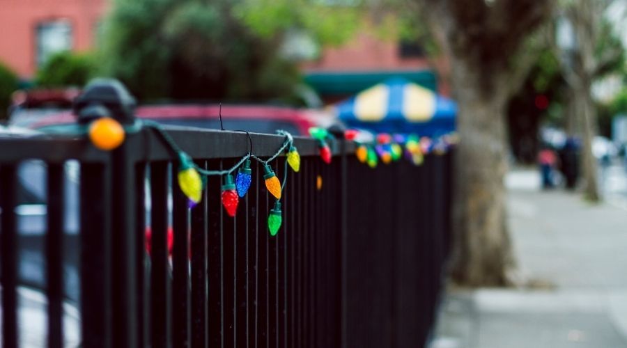 colorful Christmas lights on a fence