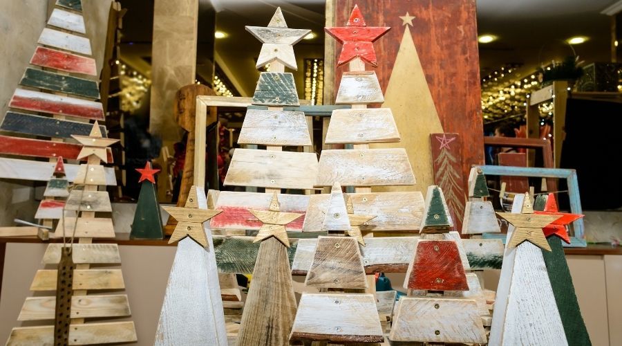 an assortment of pallet Christmas trees in different colors
