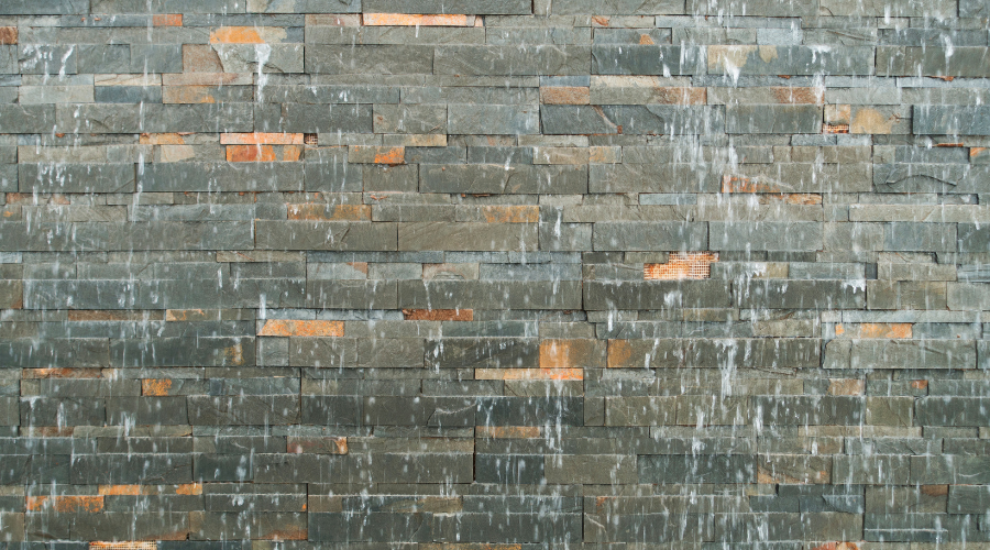 Swimming Pool Waterfall with brick stone wall