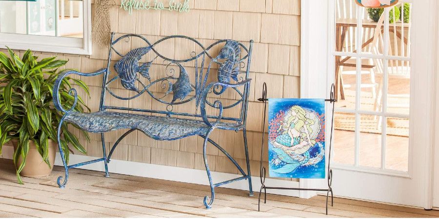 blue metal bench with fish embellishments