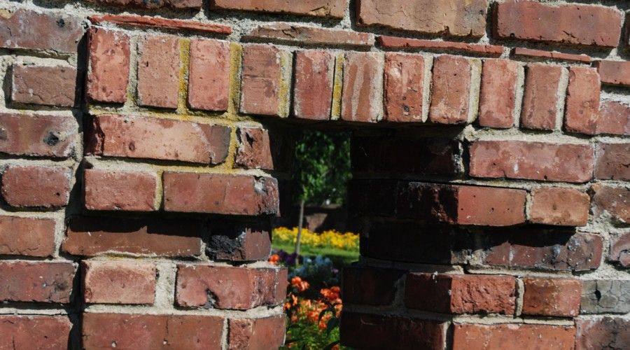 narrow window built into a brick wall