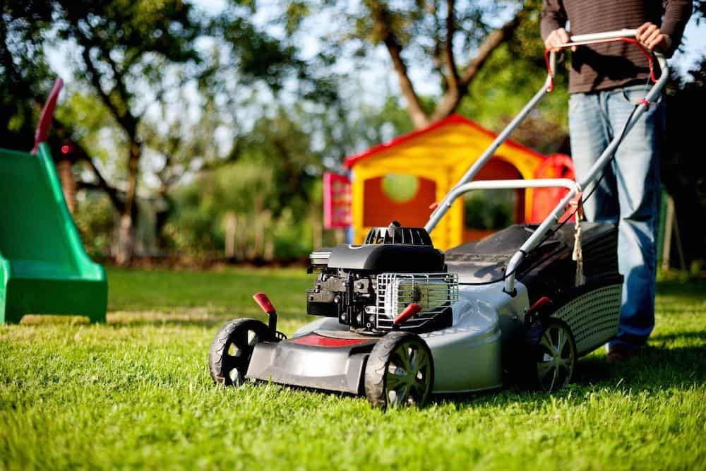 person mowing lawn