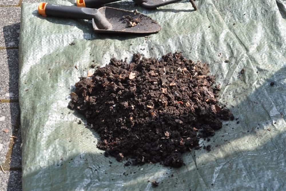 laying soil on tarp