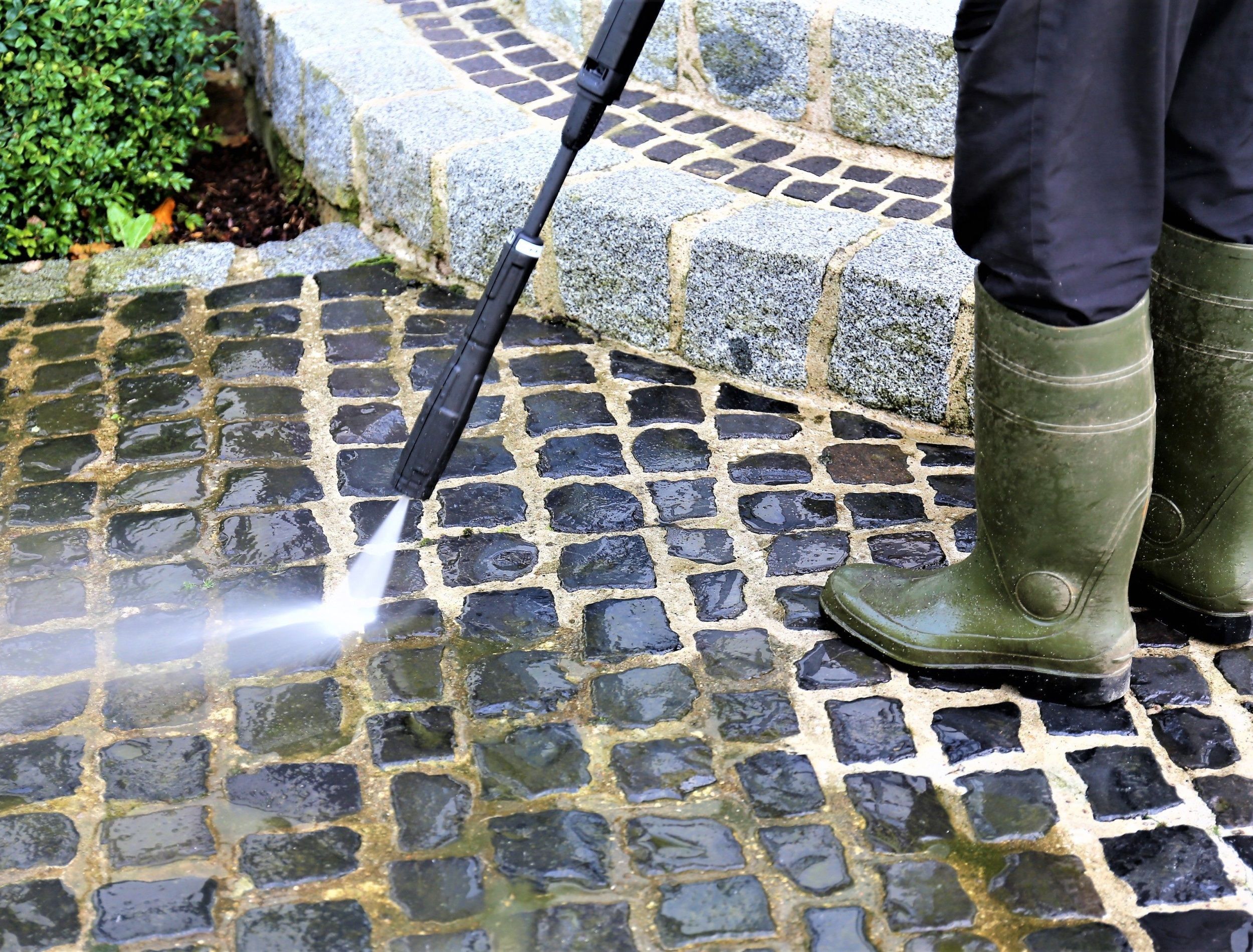 An Image of walkway cleaning - high pressure cleaner