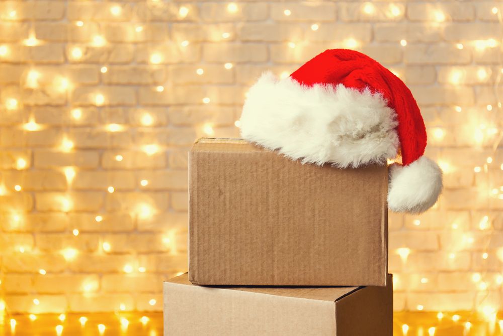 Santa hat with lights in the background on cardboard boxes 