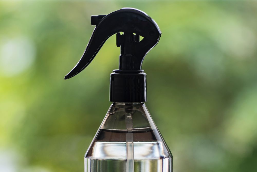 Spray Bottle For Misting Plants With a Green Backdrop
