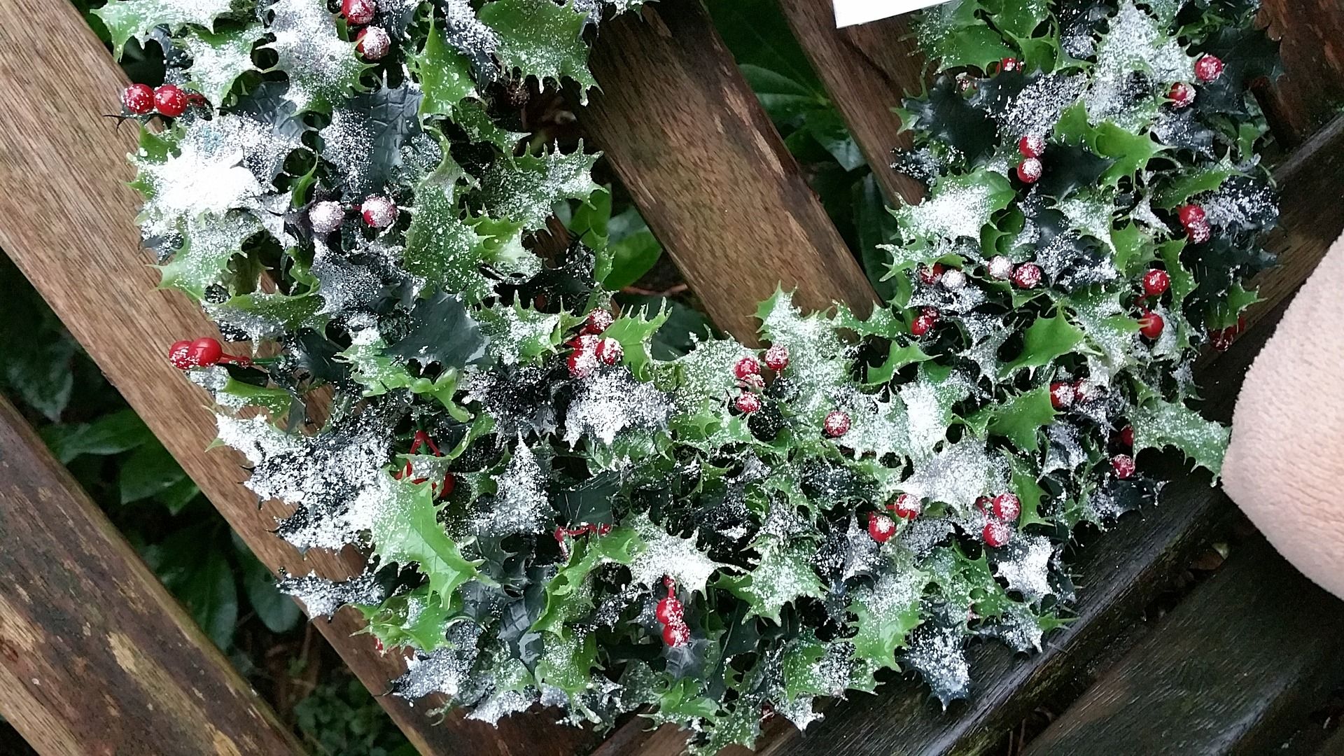 Holiday wreath outdoors in the snow