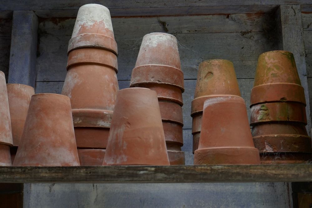 Group of terracotta pots stacked upside down