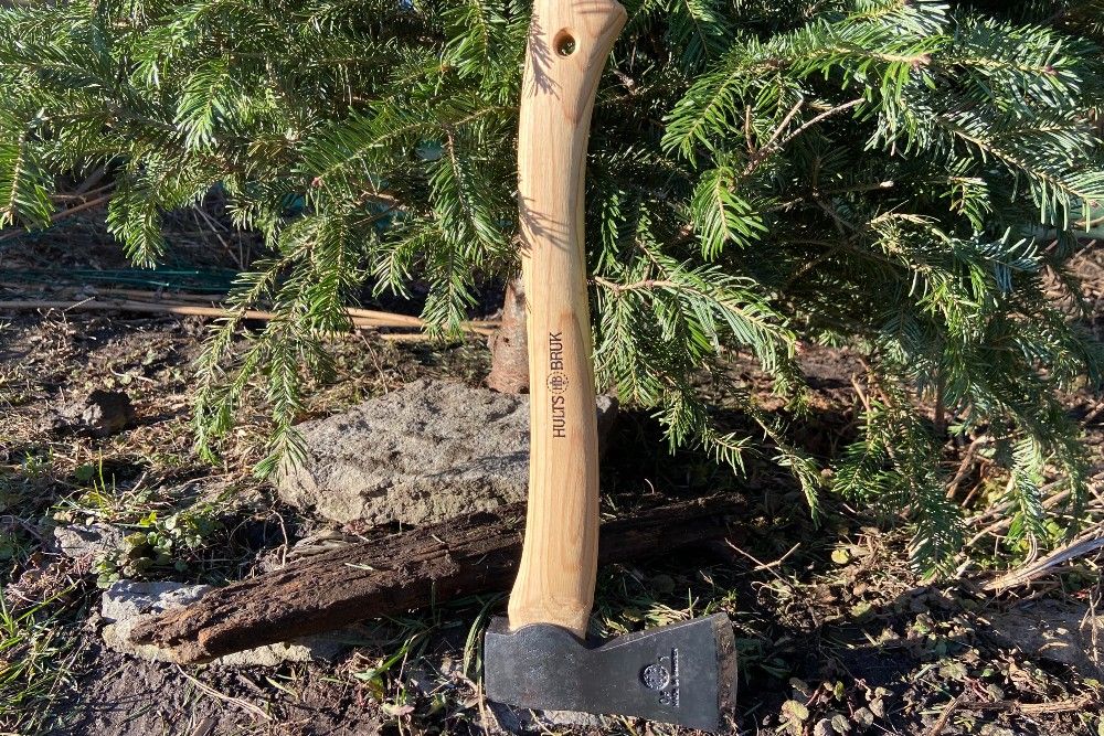 Almike Hatchet resting against a Christmas tree