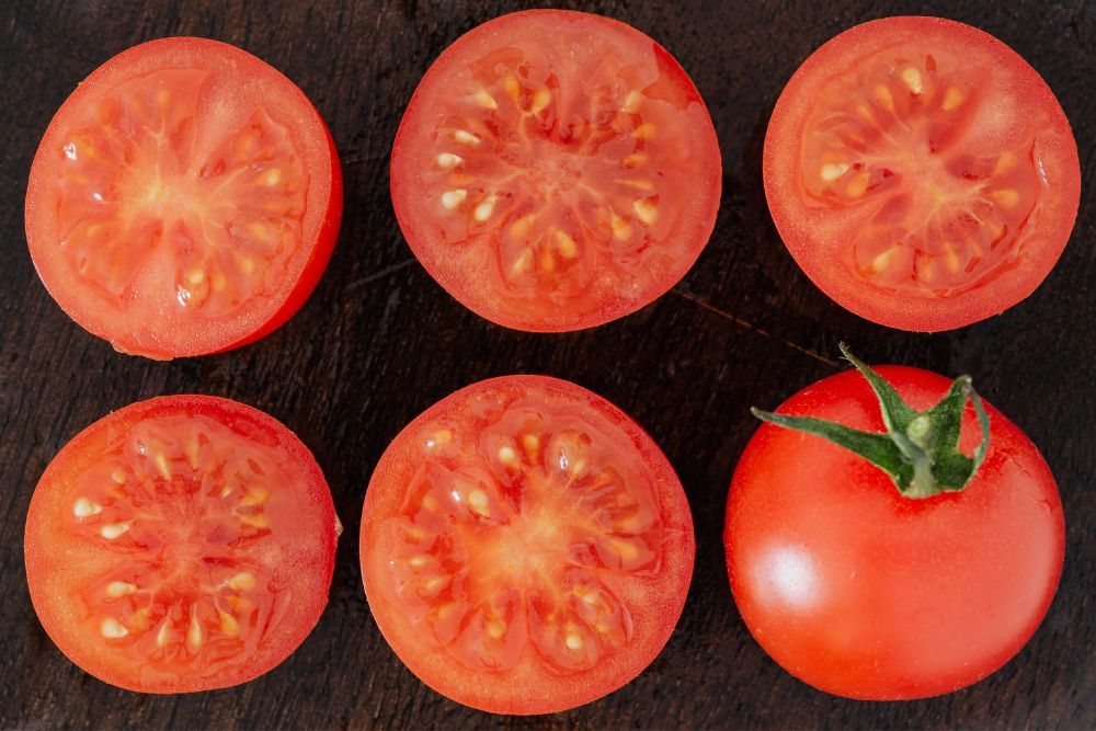 Tomatoes cut in half to show tomato seeds