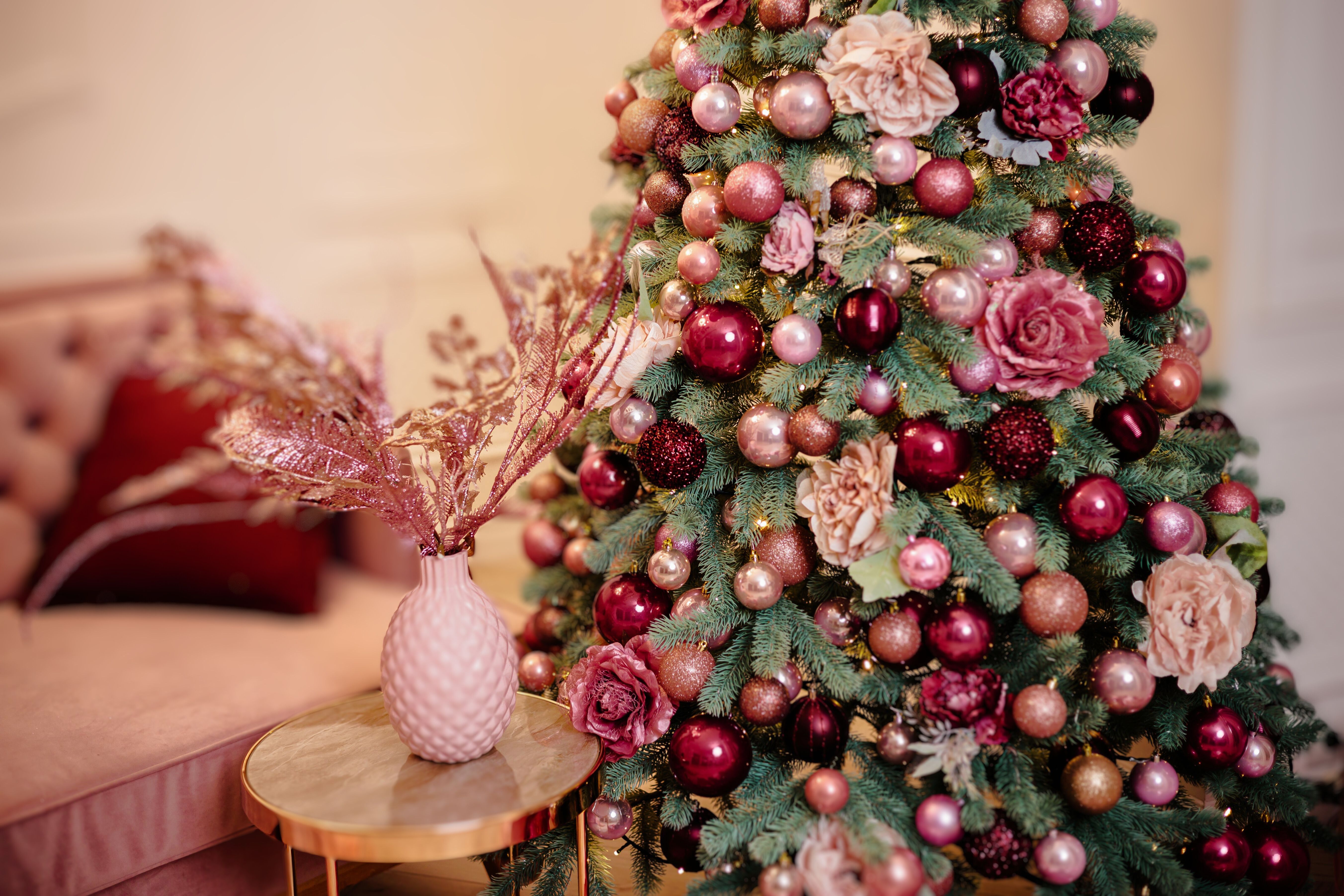 Christmas decorations on the tree, beautiful toys in light colors. Christmas atmosphere, new year