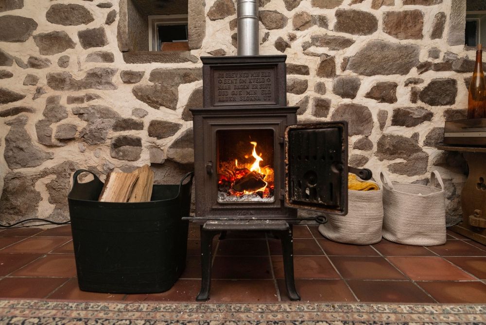 wood fireplace with wood logs in storage basket