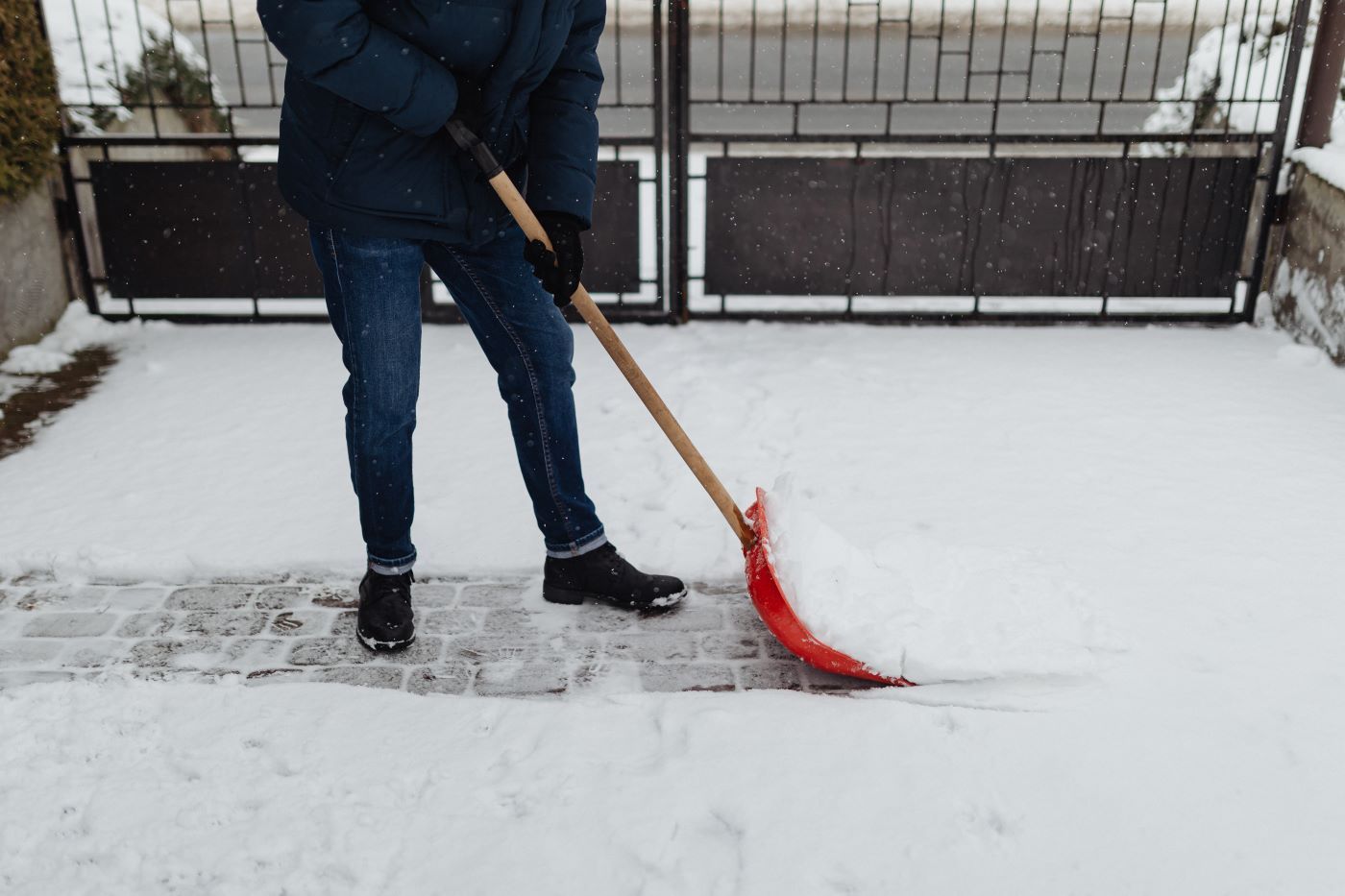 An image of a person using an electric snow blower