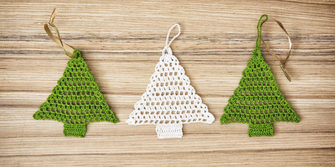 Three small crocheted Christmas trees