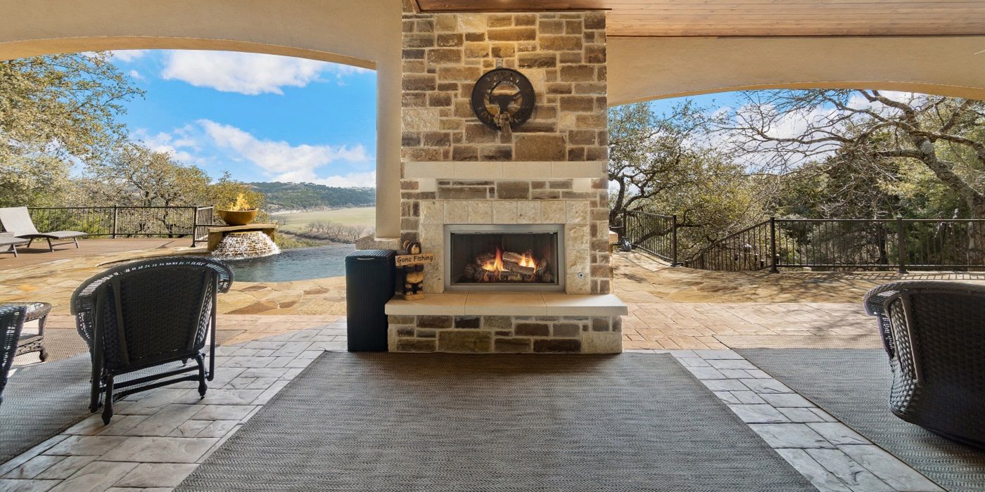 Brick and stone patio with fireplace