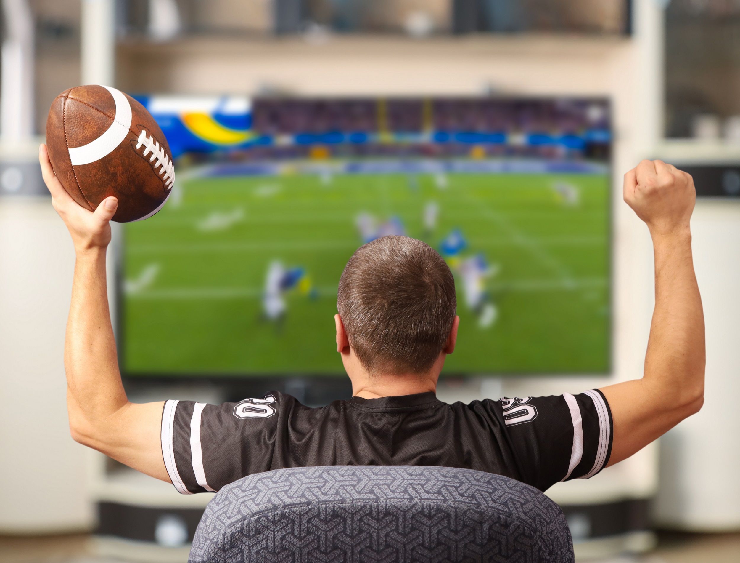 Football fan watching the Super Bowl