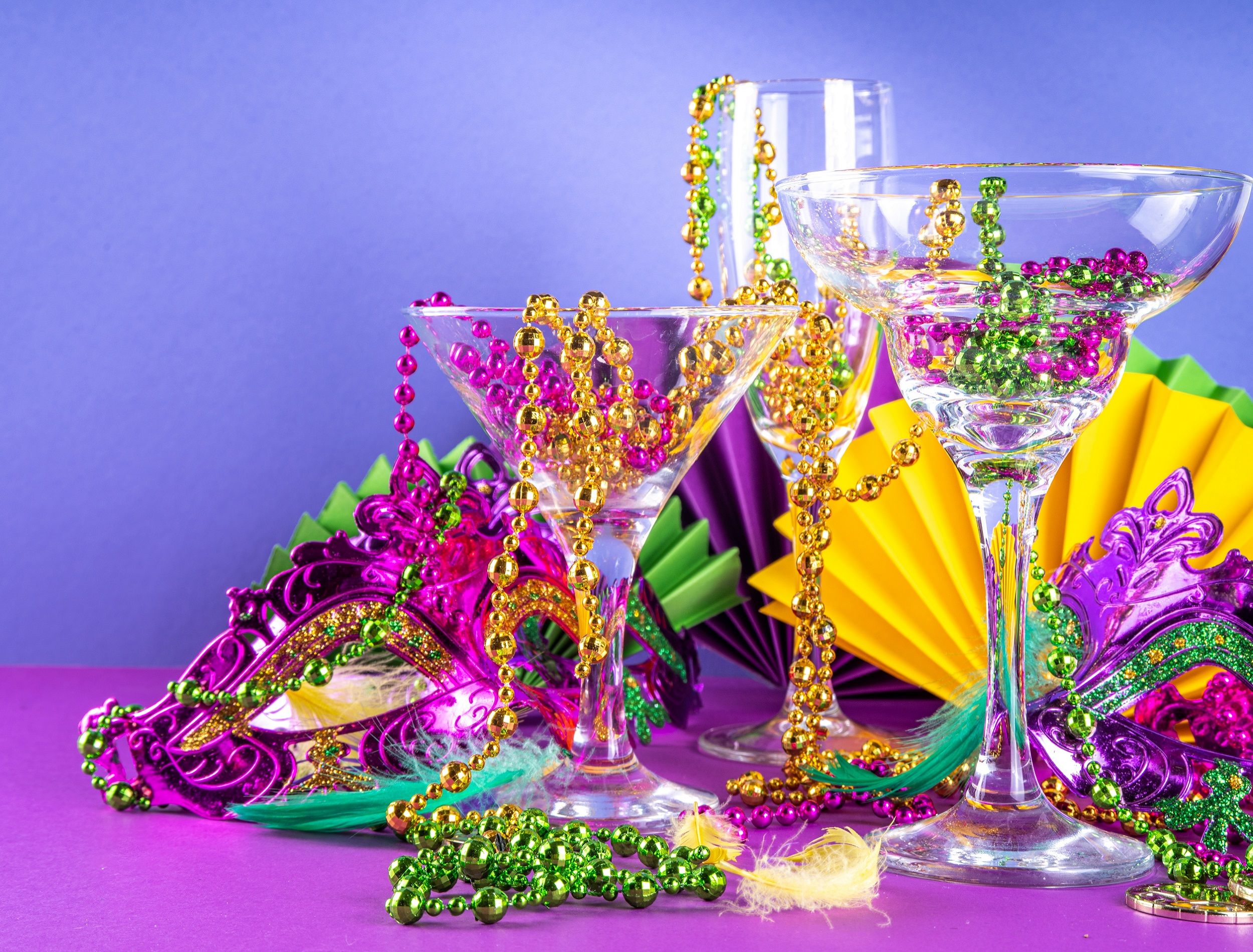 Mardis Gras items on a purple background